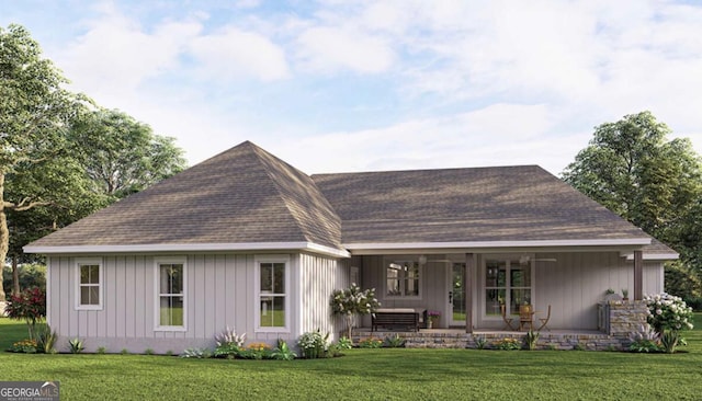 rear view of house with board and batten siding, covered porch, roof with shingles, and a lawn