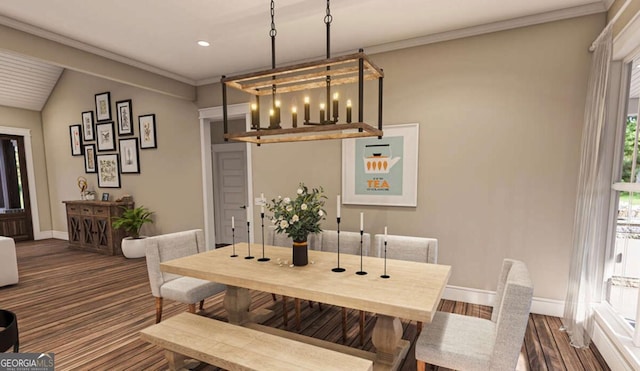 dining area featuring lofted ceiling, baseboards, and crown molding