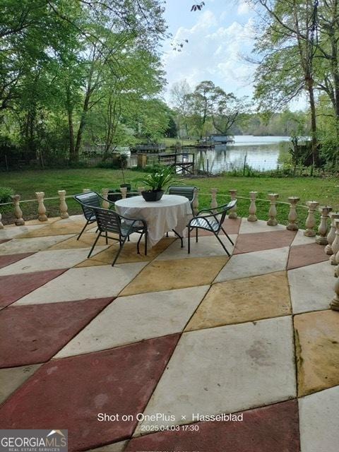 view of patio featuring a water view