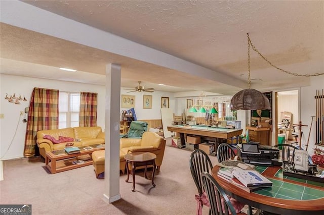 carpeted dining area with a textured ceiling and pool table