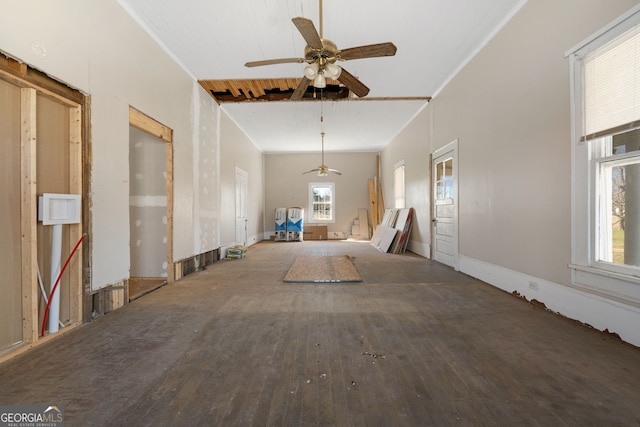 spare room featuring ornamental molding, wood-type flooring, and a ceiling fan