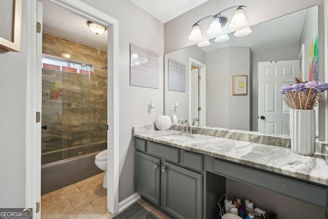 full bath featuring enclosed tub / shower combo, tile patterned flooring, vanity, and toilet