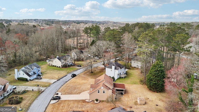 bird's eye view featuring a wooded view