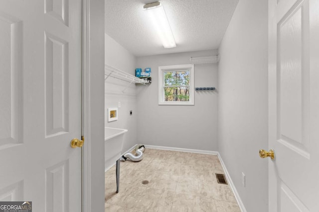 laundry room with hookup for a washing machine, hookup for an electric dryer, laundry area, visible vents, and baseboards