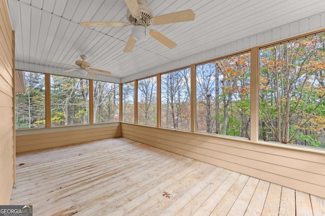 unfurnished sunroom featuring a wealth of natural light