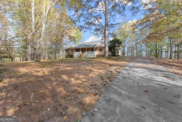 ranch-style house with covered porch