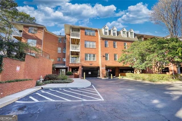 view of property featuring uncovered parking