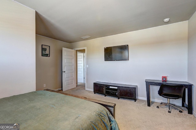 carpeted bedroom with visible vents and baseboards