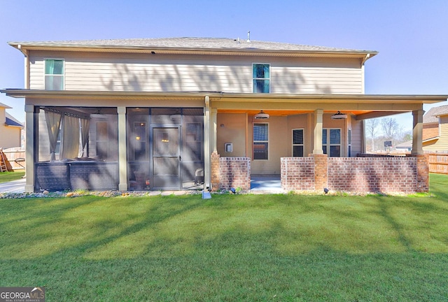 exterior space featuring a sunroom and a yard