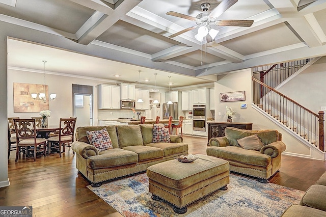 living area featuring stairs, coffered ceiling, hardwood / wood-style floors, and beamed ceiling