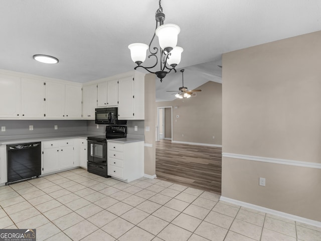 kitchen featuring light countertops, light tile patterned flooring, black appliances, and white cabinetry