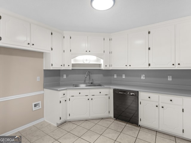 kitchen with a sink, light tile patterned floors, white cabinets, and dishwasher