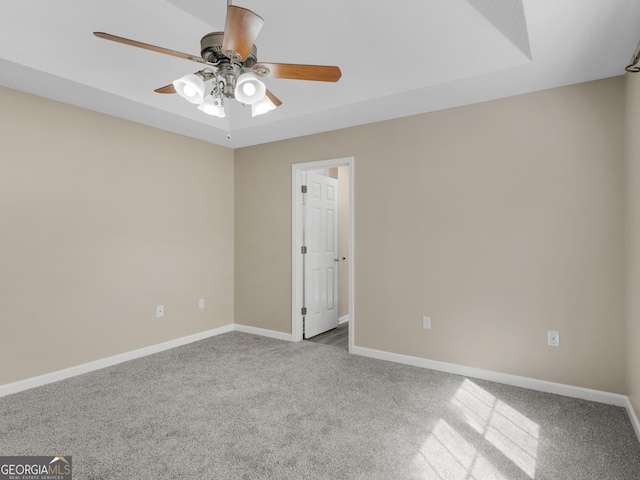 unfurnished room with ceiling fan, carpet floors, and baseboards