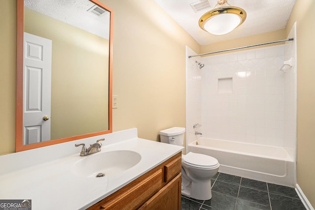 bathroom featuring tile patterned flooring, toilet, vanity, and visible vents