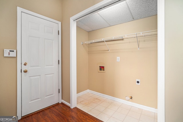 laundry room featuring baseboards, hookup for a washing machine, electric dryer hookup, gas dryer hookup, and laundry area