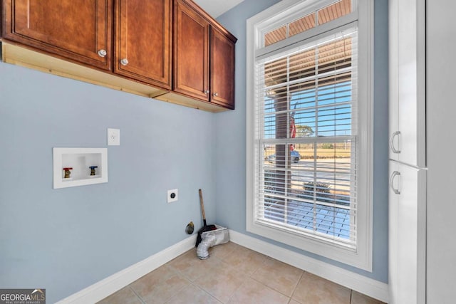 clothes washing area with washer hookup, light tile patterned flooring, cabinet space, and hookup for an electric dryer