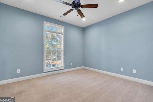 unfurnished room with light carpet, baseboards, visible vents, and recessed lighting