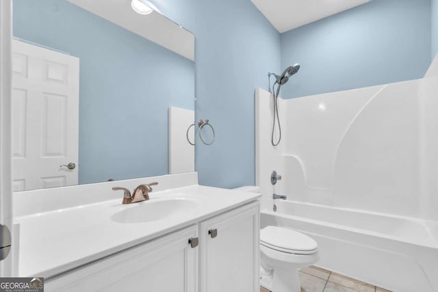 full bath featuring vanity, shower / washtub combination, tile patterned flooring, and toilet