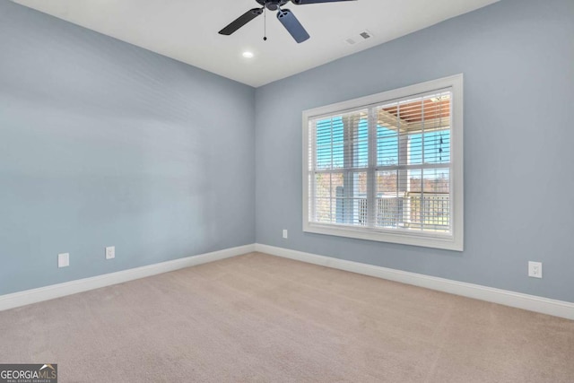 unfurnished room featuring recessed lighting, light colored carpet, a ceiling fan, baseboards, and visible vents