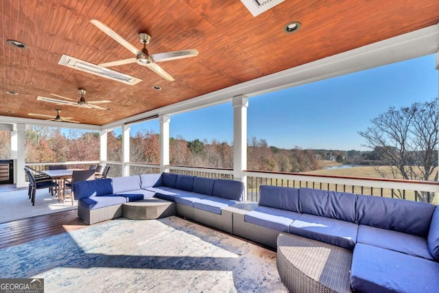 view of patio / terrace featuring ceiling fan, a deck, an outdoor hangout area, and outdoor dining space