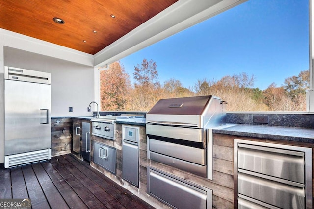 view of patio featuring exterior kitchen and area for grilling