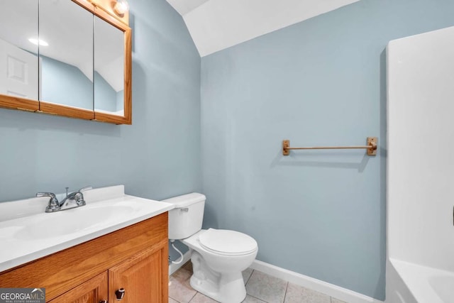 full bathroom with baseboards, toilet, tile patterned flooring, a washtub, and vanity