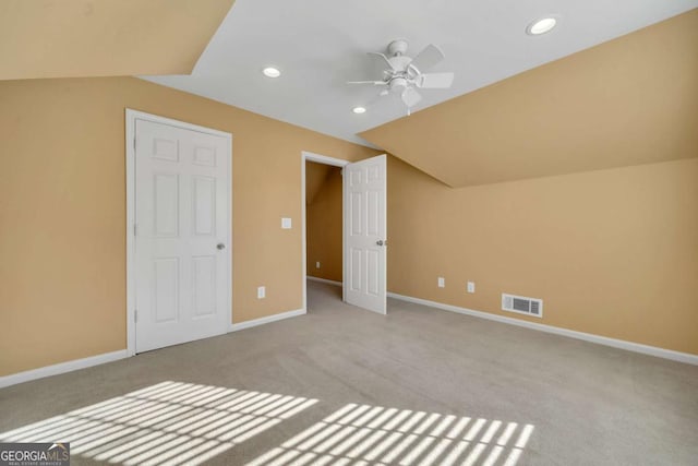 unfurnished bedroom with vaulted ceiling, recessed lighting, visible vents, and baseboards