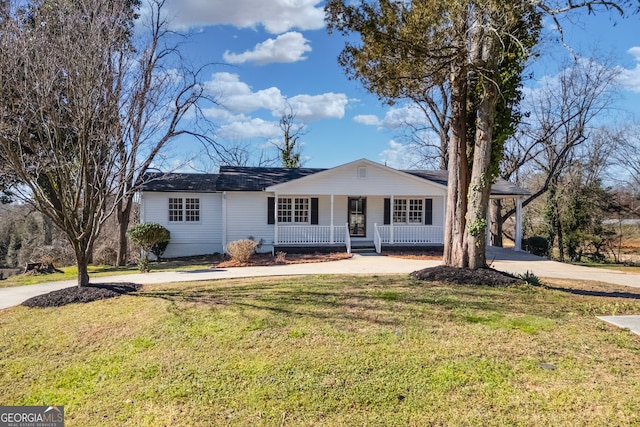 single story home featuring covered porch, concrete driveway, and a front yard