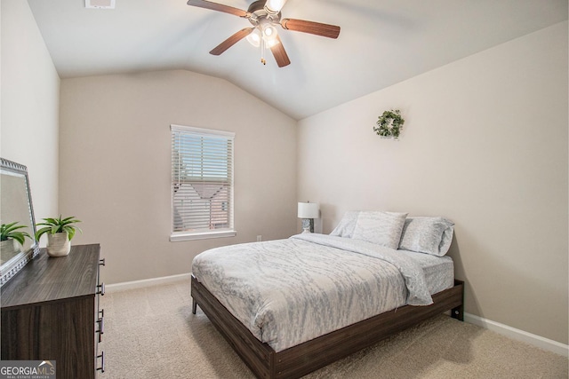 bedroom with light carpet, vaulted ceiling, baseboards, and ceiling fan