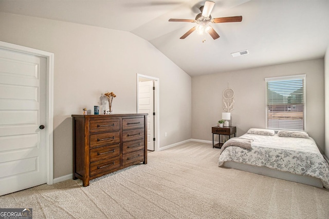 bedroom featuring light carpet, vaulted ceiling, visible vents, and baseboards
