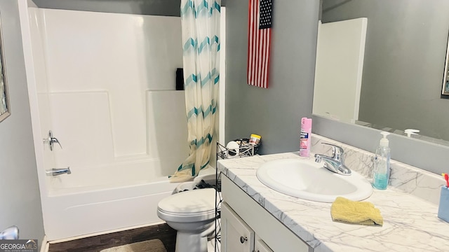 full bath featuring toilet, shower / bath combo, and vanity