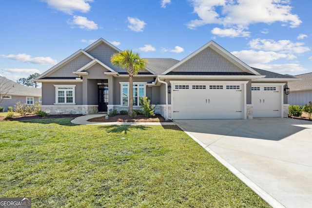 craftsman-style home with a garage, concrete driveway, stone siding, a front lawn, and stucco siding