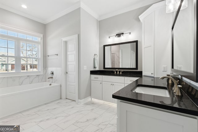 full bathroom featuring ornamental molding, marble finish floor, a garden tub, and vanity