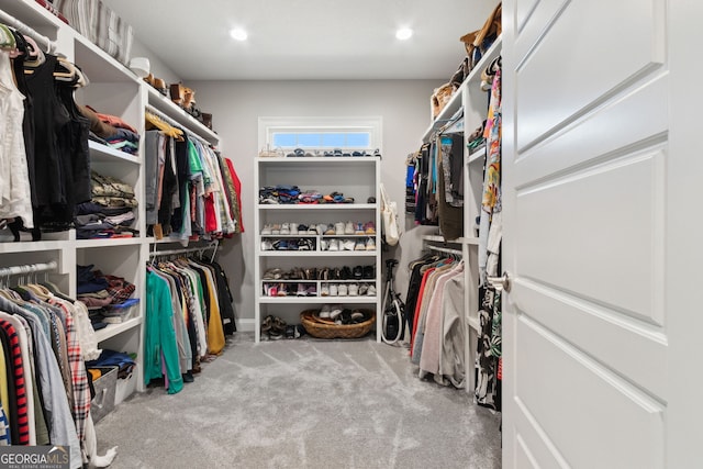 walk in closet featuring carpet