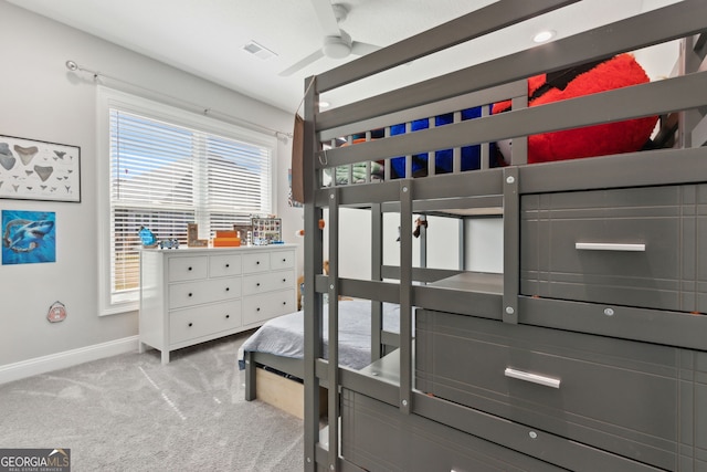 carpeted bedroom with visible vents and baseboards