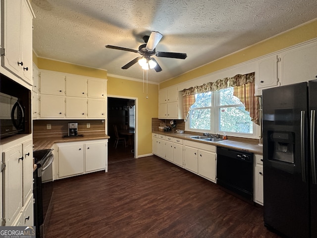 kitchen featuring black appliances, dark wood-type flooring, a sink, and white cabinetry