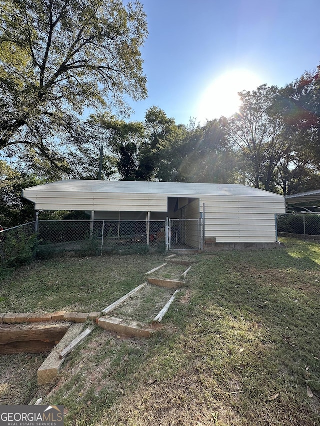 view of outbuilding with an outbuilding and fence