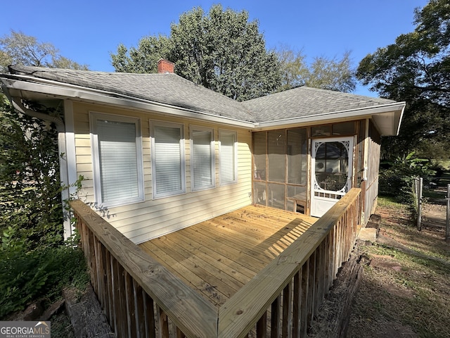 wooden terrace with a sunroom