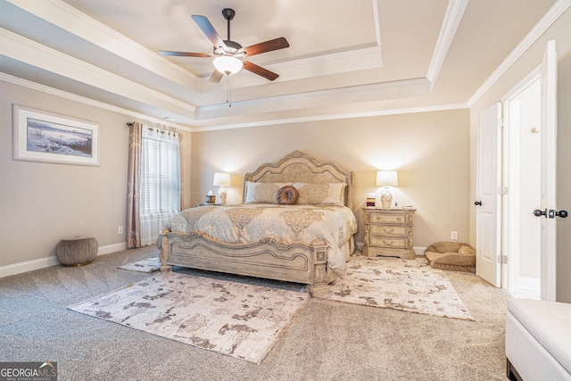 bedroom with carpet floors, crown molding, a raised ceiling, ceiling fan, and baseboards