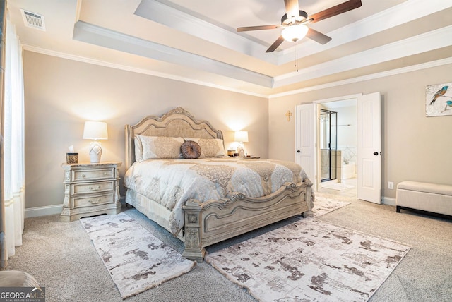 bedroom featuring carpet, visible vents, a raised ceiling, and crown molding