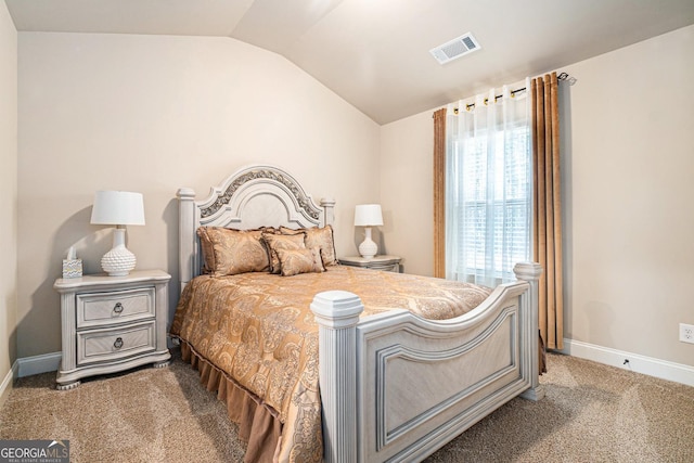 carpeted bedroom featuring baseboards, visible vents, and vaulted ceiling