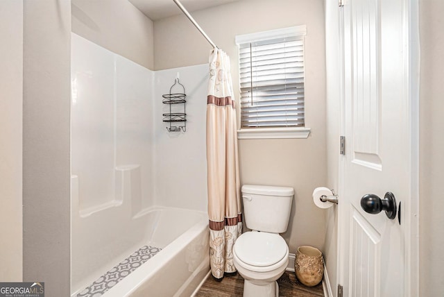 bathroom featuring shower / tub combo with curtain, toilet, and wood finished floors