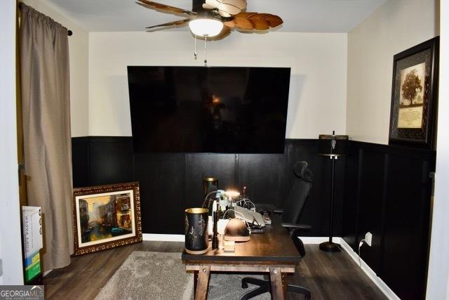 office area featuring wainscoting, ceiling fan, and wood finished floors