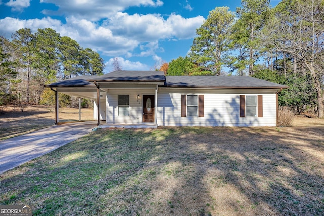 single story home with an attached carport, driveway, and a front yard