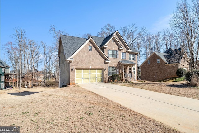 view of front facade featuring driveway and brick siding