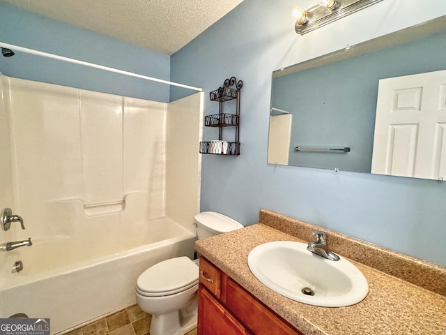 bathroom with toilet, vanity, a textured ceiling, and shower / bathtub combination