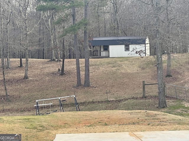 exterior space featuring a yard and fence