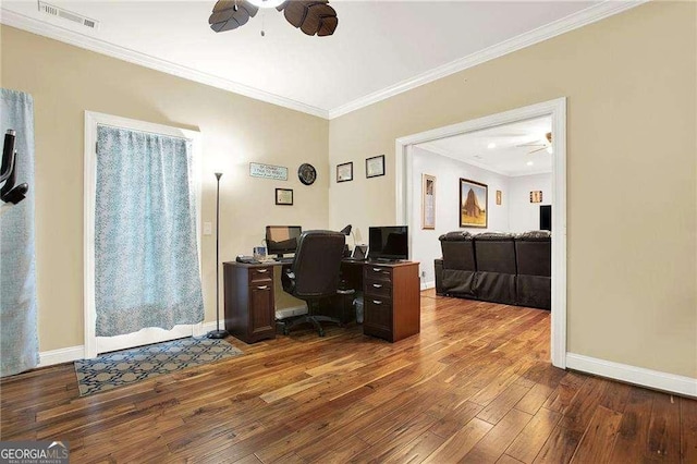 office area with ceiling fan, hardwood / wood-style flooring, visible vents, baseboards, and crown molding