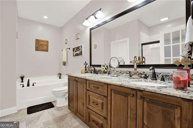 full bathroom with a garden tub, double vanity, a stall shower, and a sink