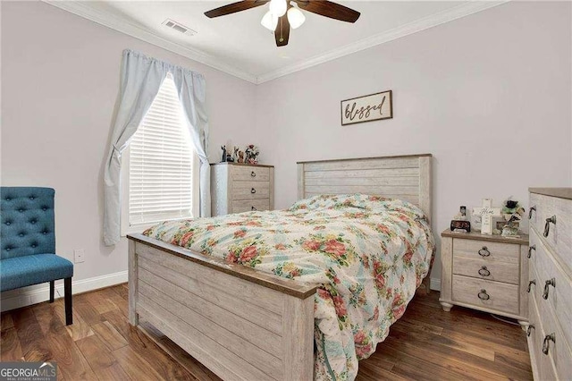 bedroom featuring visible vents, dark wood finished floors, baseboards, ceiling fan, and ornamental molding